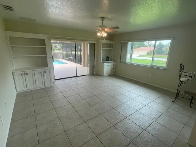 Family Room / Kitchen Combo with pool view