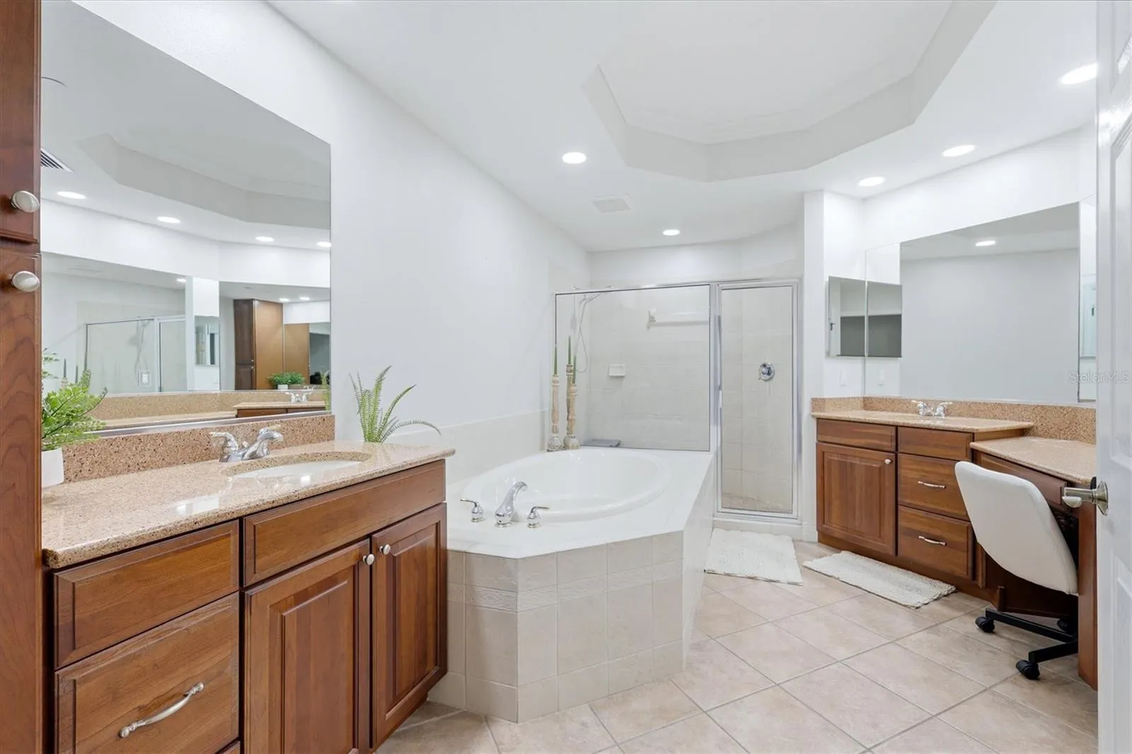 Primary Bathroom with deual sinks, vanity granite counters, soaker tub and large walk in shower