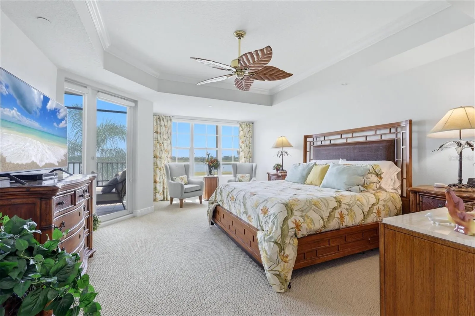 Primary Bedroom, coffered ceiling, with motorized room darkening shades, private access to lanai