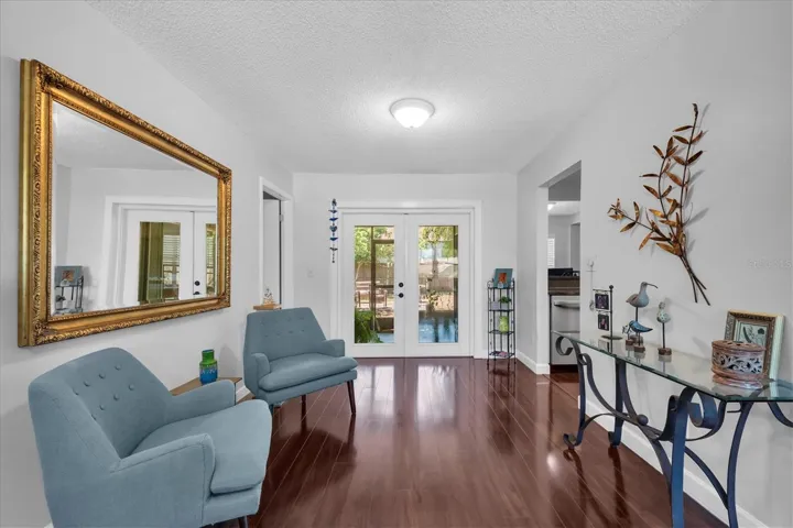 Currently part of the living room, this area can easily serve as a dining area enabling a family room where current dining room is