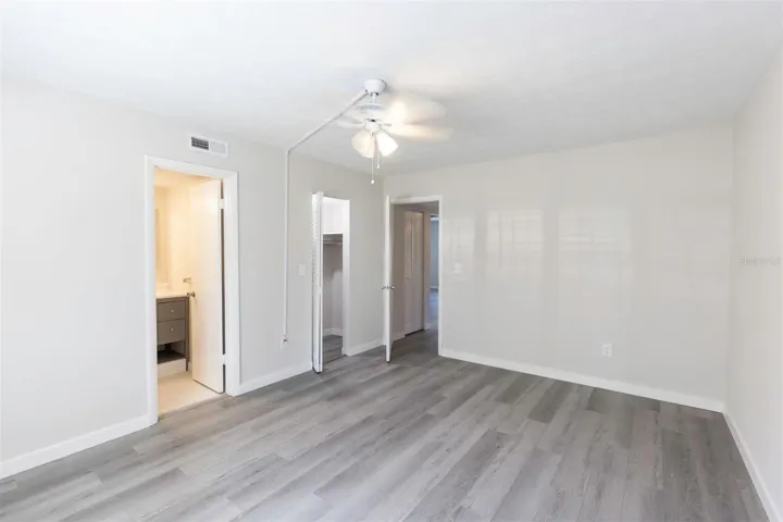 Primary Bedroom to En-Suite, walk in closet and hallway