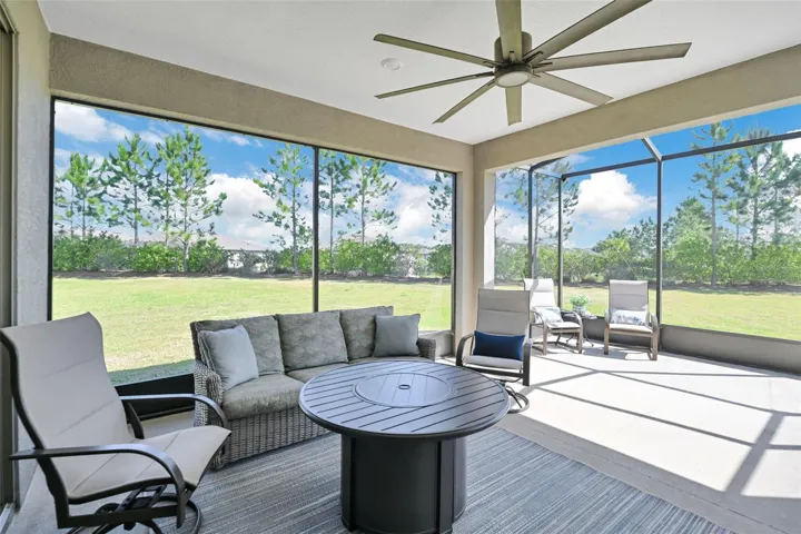 Extended Screened Lanai and Cage w/ Large Ceiling Fan on Expansive Pie-shaped Lot