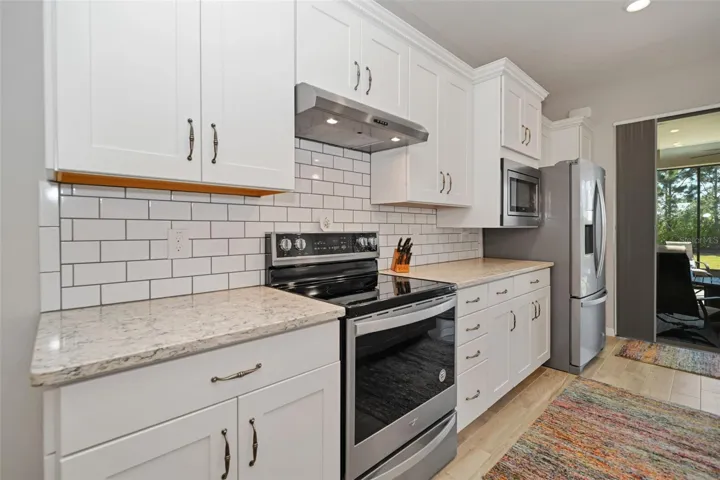 Kitchen with SS Appliances, Upgraded Backsplash & Countertops