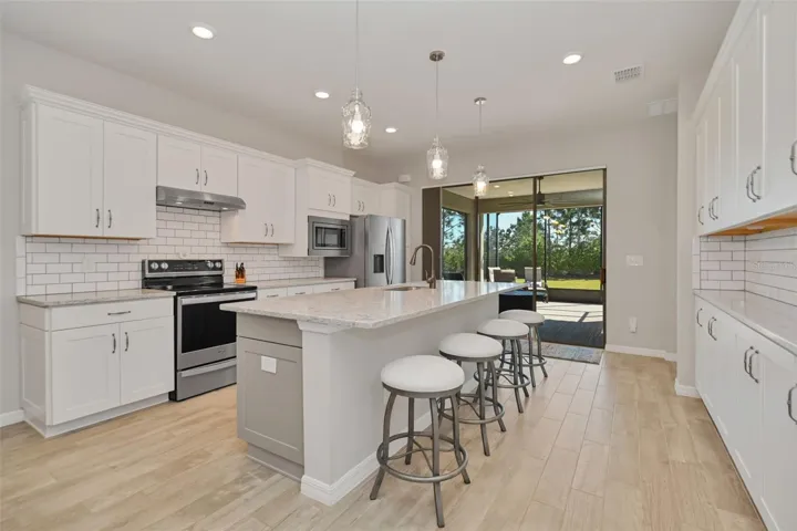 Kitchen with Island, Additional Cabinetry & Quartz Countertops