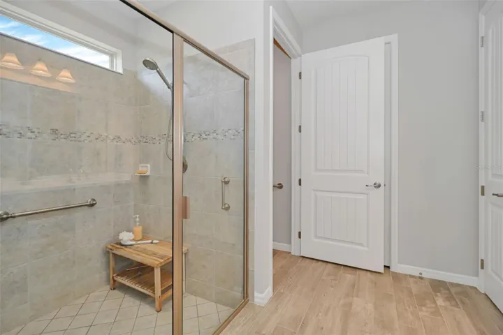 Main Bath with Enlarged Shower & Private Commode