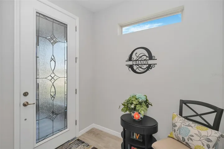 Foyer with beautiful Front Door Glass Insert