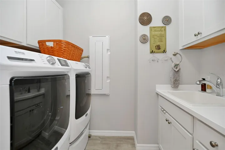 Laundry Room with Sink and built-in Cabinetry
