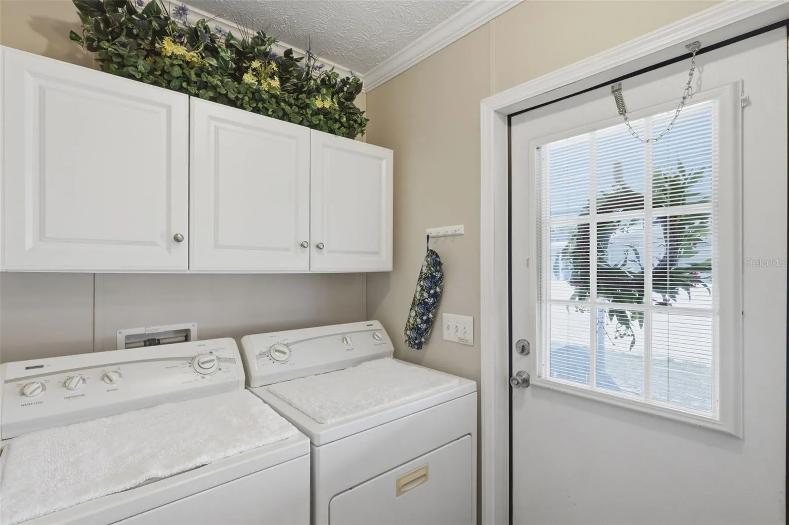 Indoor laundry room with storage