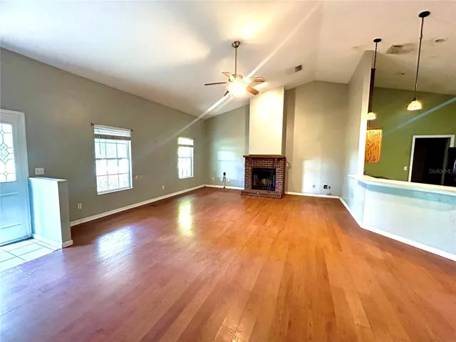 Living room with wood burning fireplace