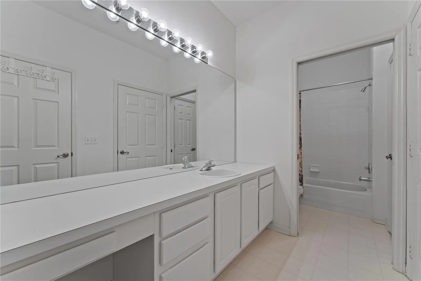 Full guest bathroom with separate tub/shower and toilet.
