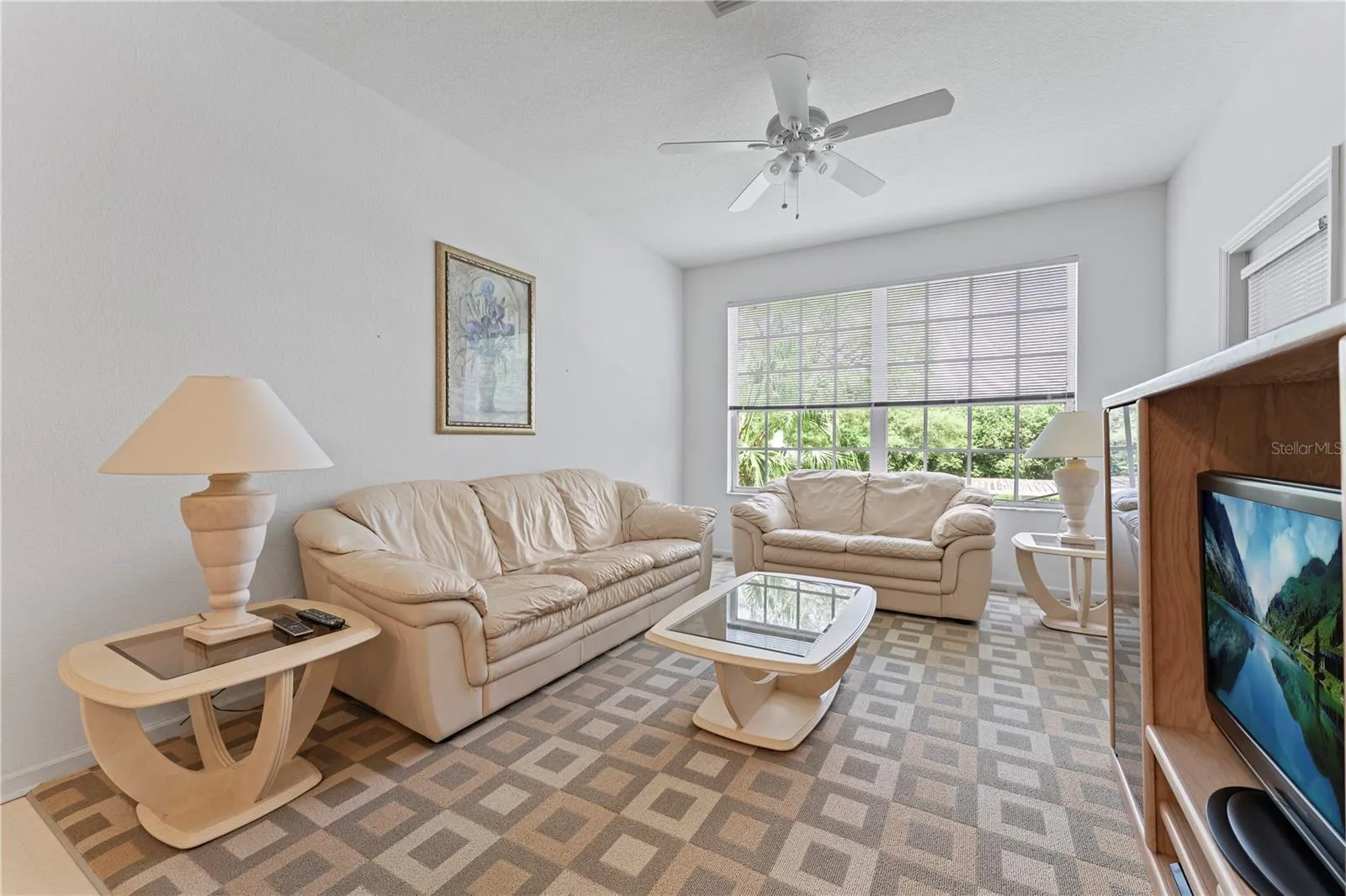 Living room with plenty of seating anf natural light