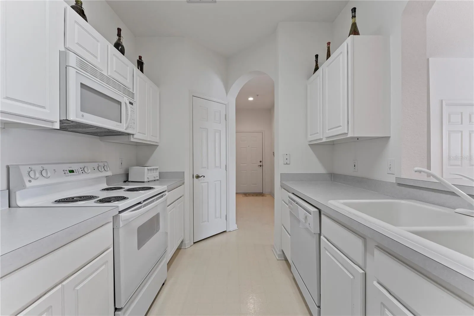 Kitchen has a closet pantry and plenty of cabinet space for storage