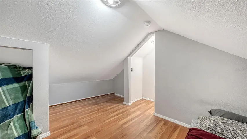 Apt #2 Attic bedroom with laminate floors