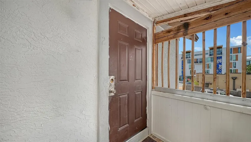 View of upstairs Apt #2 entry door on south side of the building.