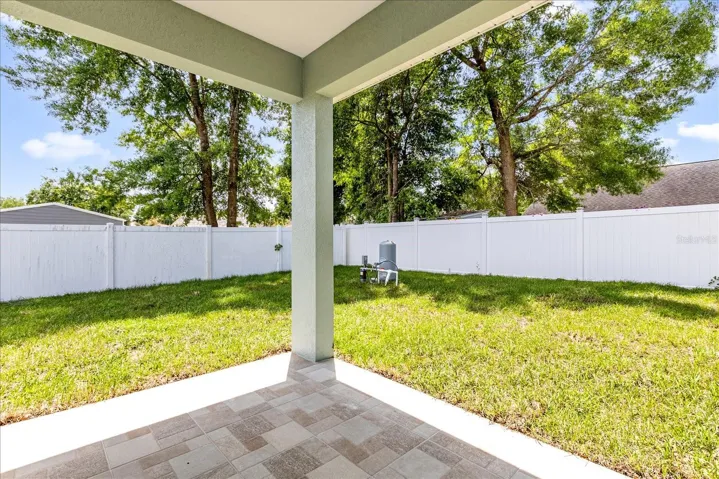Covered patio ideal for outdoor dining & relaxing