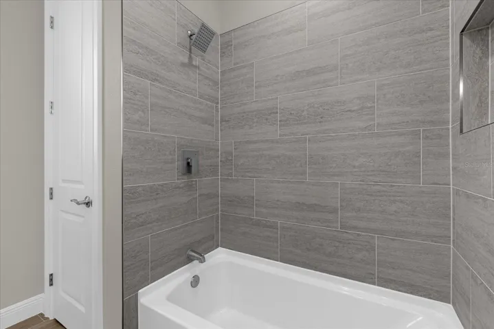 Guest bathroom with tiled tub