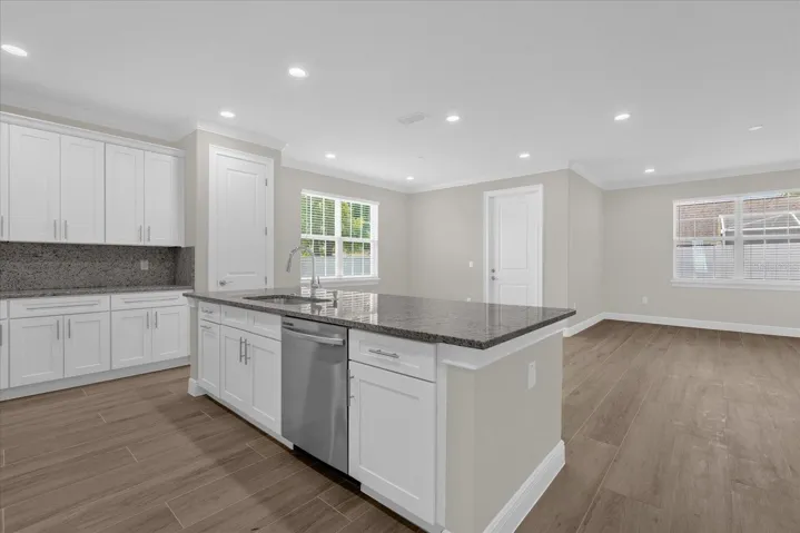 Kitchen with island and view of the living room