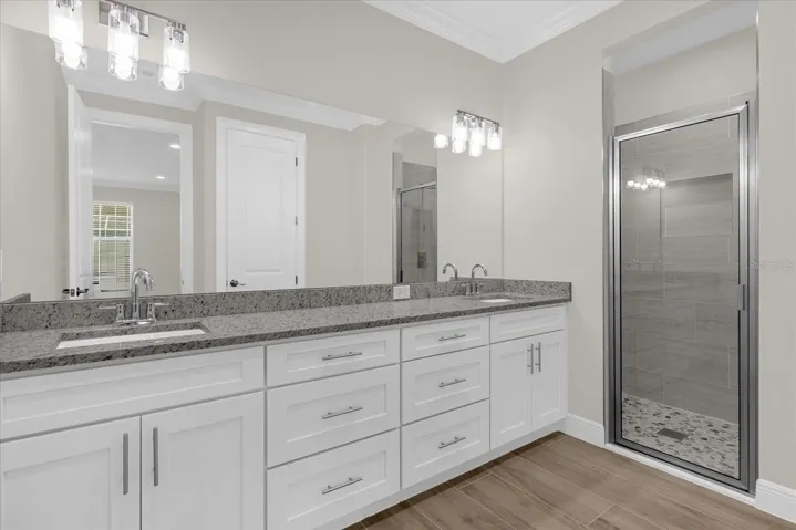 Ensuite bathroom, dual vanities, and walk-in shower.