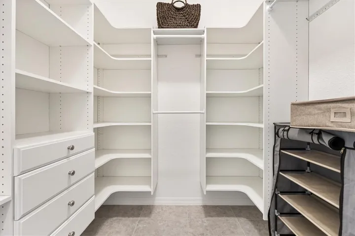 California style closet in Primary.