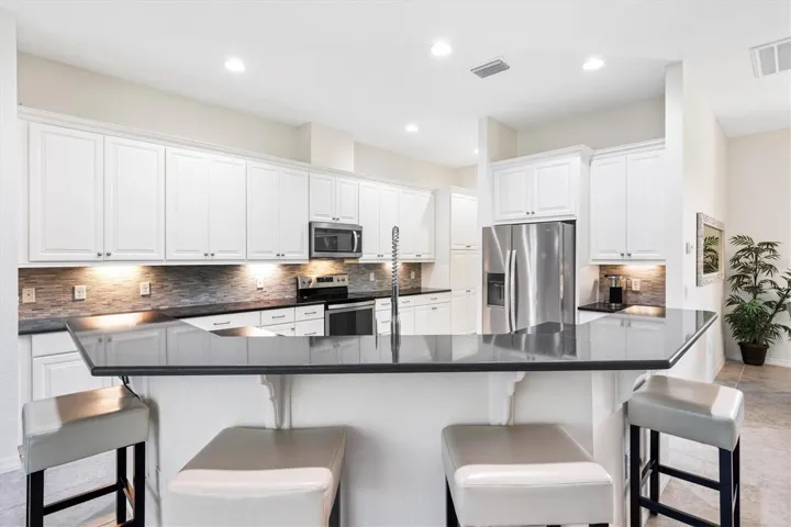 Under cabinet lighting, pull-outs in cabinets.