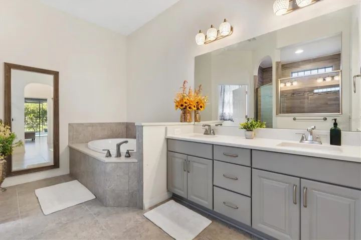 Dual sinks in vanity with quartz counter top in Primary.