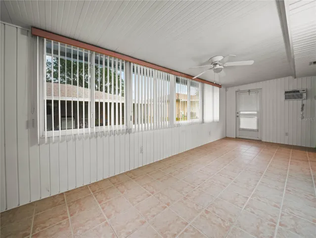 Enclosed Patio with blinds and ceramic tile