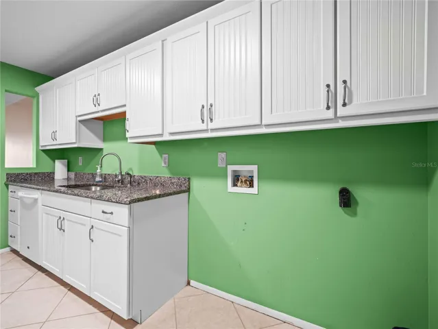 Kitchen and laundry hookup space.
