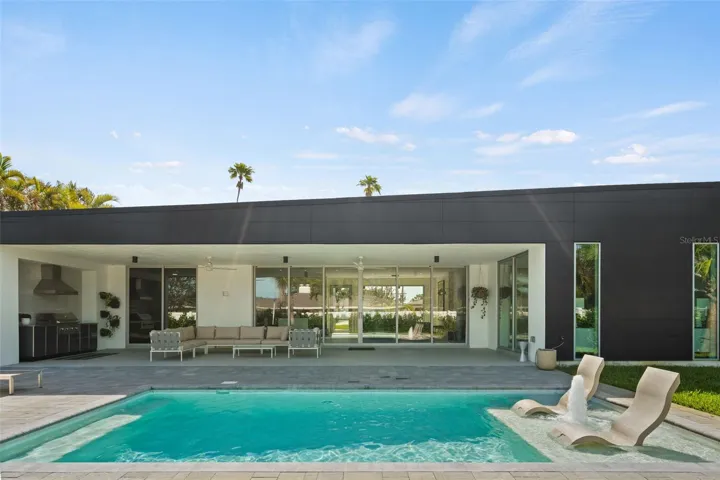 Covered Outdoor Kitchen and Living Area, Steps From Your Pool.