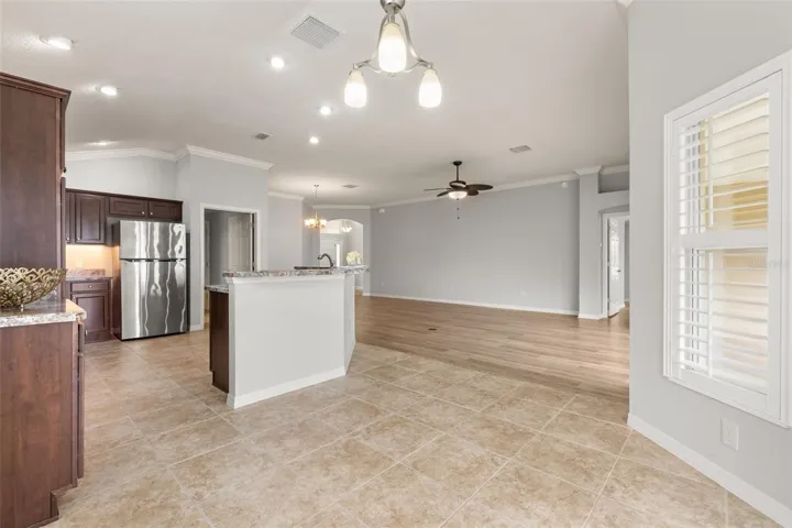 Open breakfast bar to living, dining and breakfast areas.