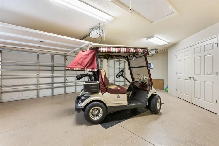 2 car + golf car garage - cart conveys with sale of the home.