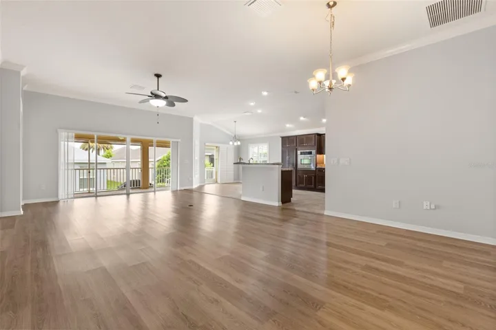 Iris model featuring open dining, living, and kitchen spaces with an extended lanai ideal for entertaining.