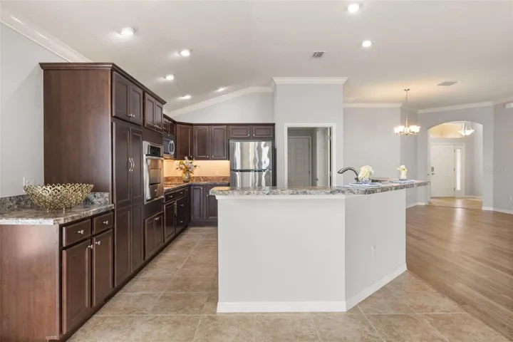 Kitchen with pantry, pullout drawers, and extended cabinet, great for serving. W/D room off of kitchen