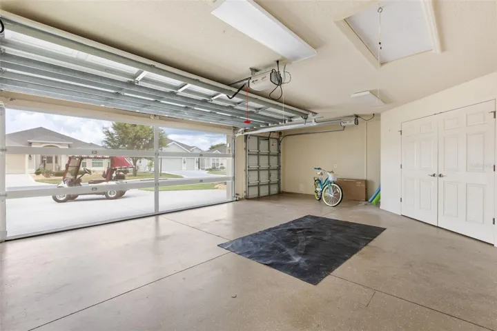 Garage breeze screen down; epoxy-coated floor.