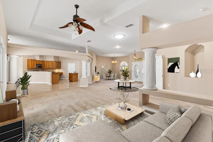 Virtually staged living room looking toward dining room