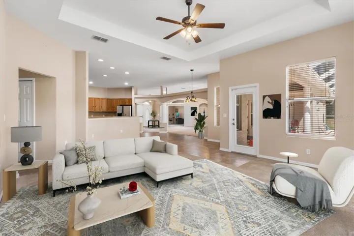 Virtually staged great room looking toward kitchen.