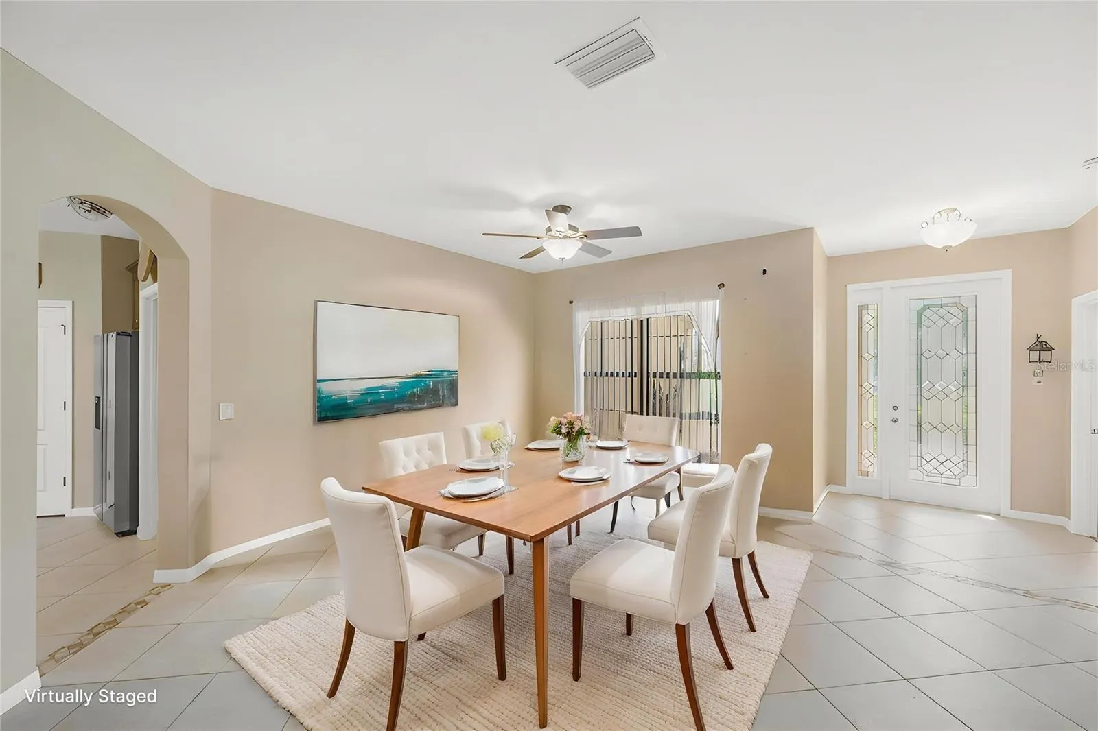 Just beyond the beautiful leaded glass front door with sidelight is the Dining/Living room area.