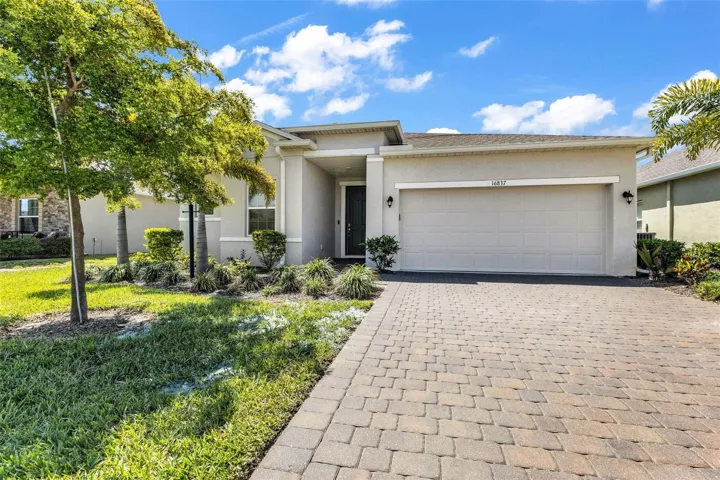 Welcome home to 16837 Canopy Garden Drive located in The Hammocks in West Port.