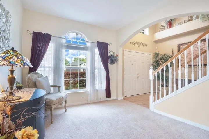 GRACEFUL ARCHED DOORWAYS add architectural detail and timeless character, enhancing the home’s warm and welcoming flow.