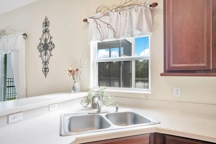 You have a view of the backyard and pond from your Kitchen window.