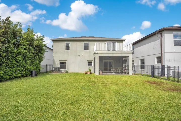 Step outside to the covered, screened patio and FENCED BACKYARD, where TRANQUIL POND AND CONSERVATION VIEWS create a serene backdrop—ideal for relaxing evenings or weekend gatherings.