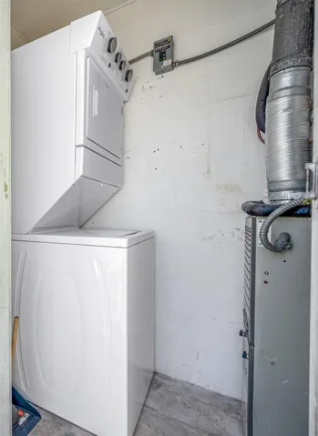 In-unit stacked washer/dryer