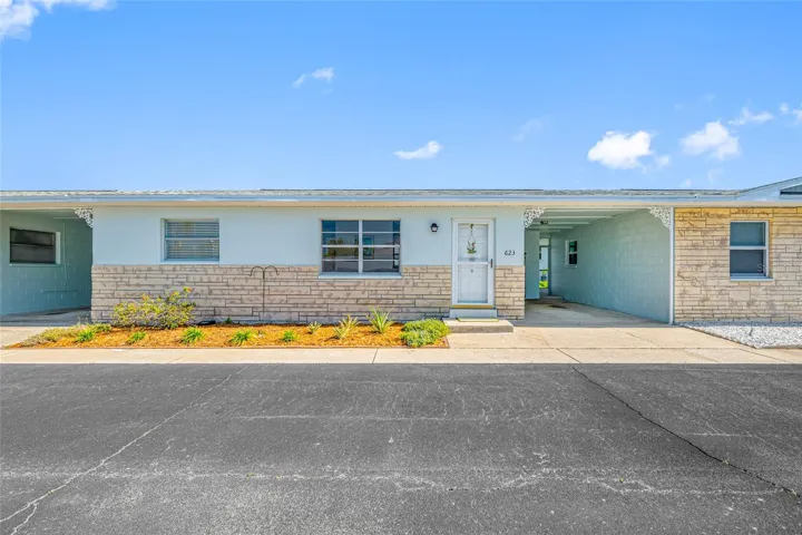 Front of home with private carport