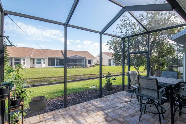 Upgraded paver patio with peaceful water views