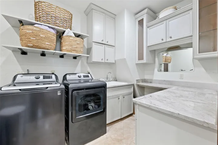 primary laundry room upstairs. connects to master closet.
