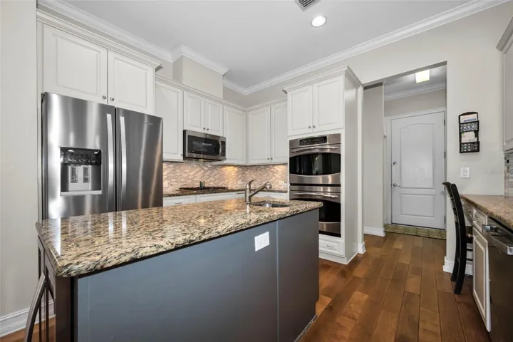 KITCHEN WITH HALLWAY TO PANTRY AND LAUNDRY ROOM