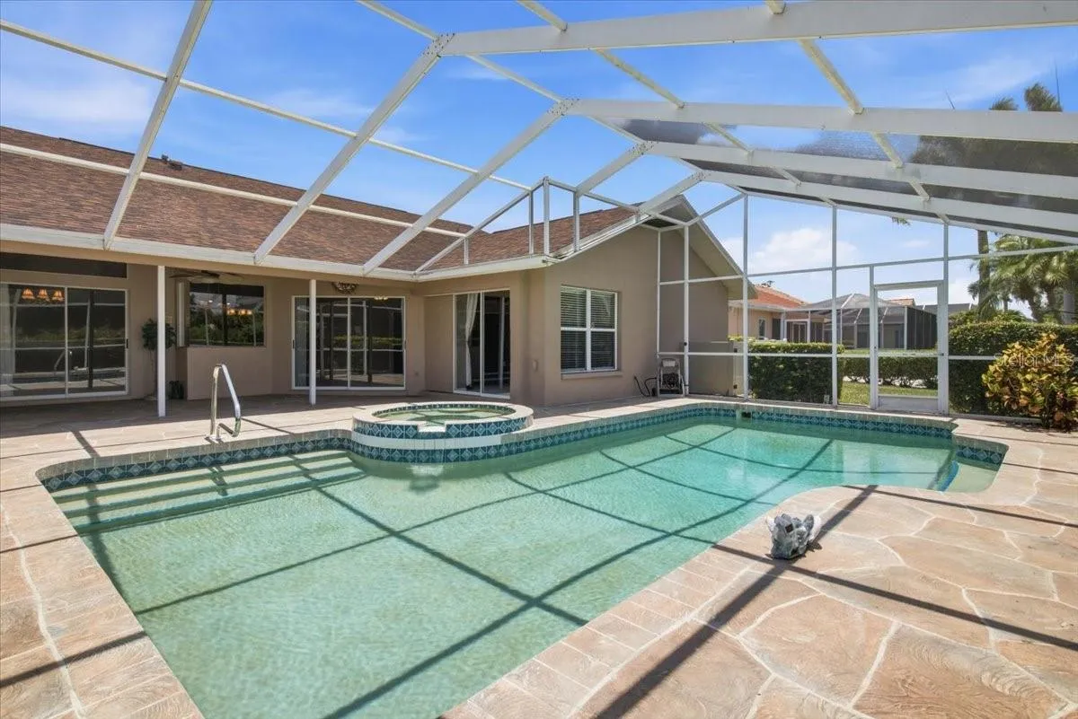 View of pool and lanai from golf course side