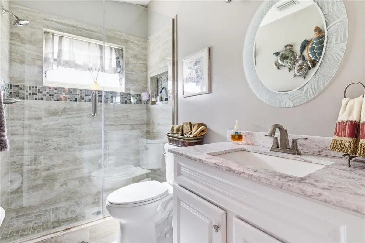 Bath two is located next to second bedroom for convenience of guests