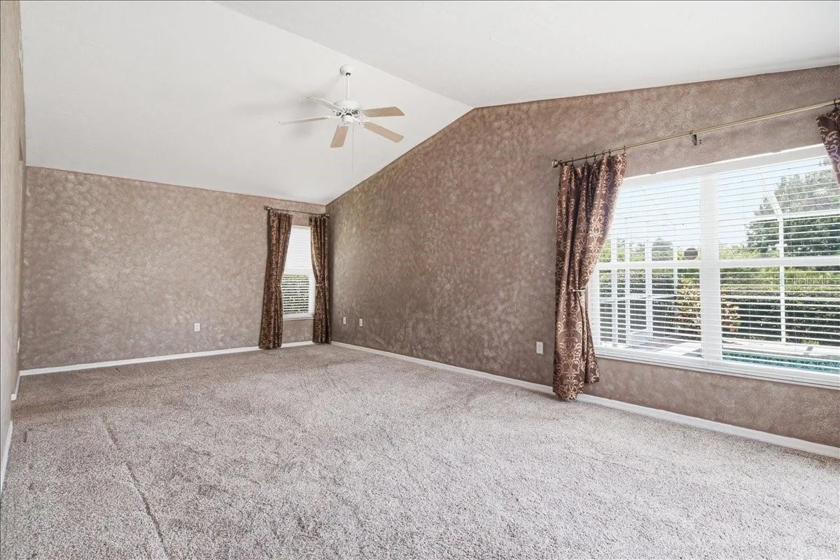 Primary bedroom accommodates large suite of furnishings