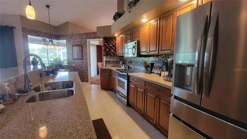 Large kitchen with island and bar seating