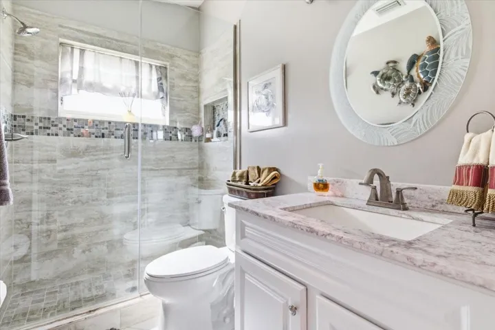 Bath two is located next to second bedroom for convenience of guests